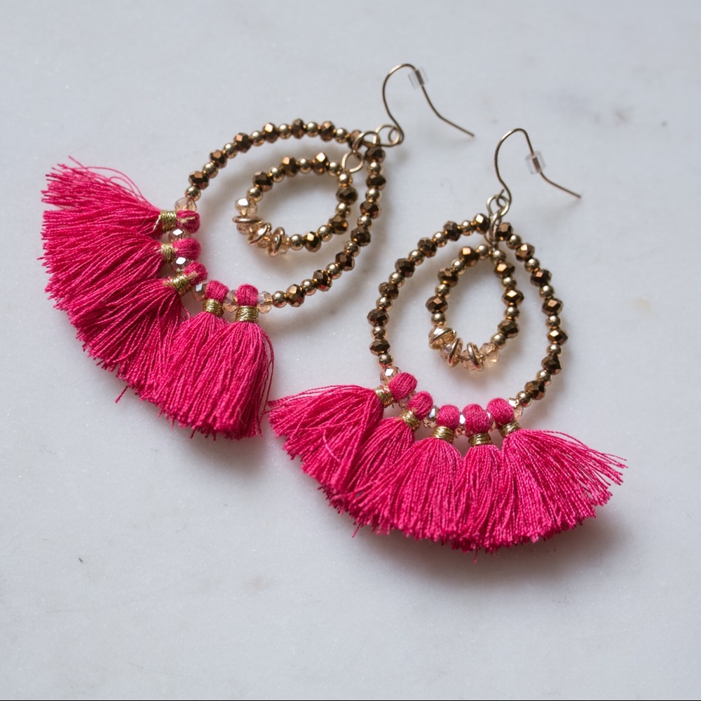 Bright pink tassel statement earrings
